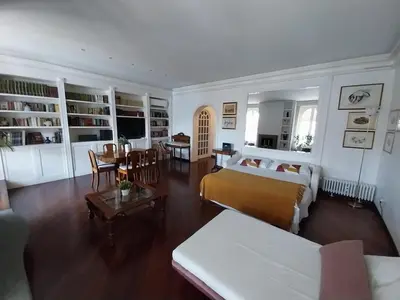 a bedroom with a bed and a living room at Urbanflat Colosseum in Rome