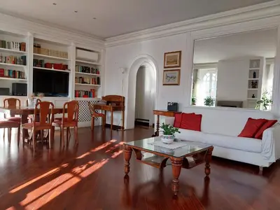 a living room with a white couch and a table at Urbanflat Colosseum in Rome