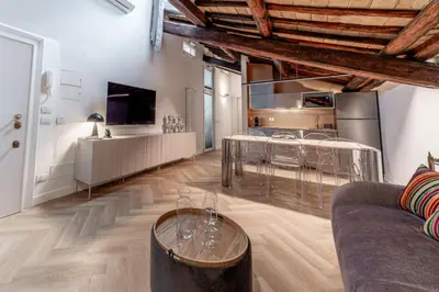 a living room with a couch and a table at Madama Lucrezia - Fontana di Trevi & Pantheon in Rome