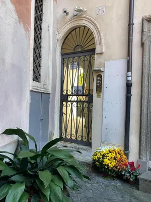 a door to a building with flowers in front of it at Madama Lucrezia - Fontana di Trevi & Pantheon in Rome