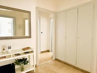 a bathroom with a mirror and a white cabinet at Il Sogno di Balduina a 1 min Stazione Appiano-Ospedale Gemelli in Rome