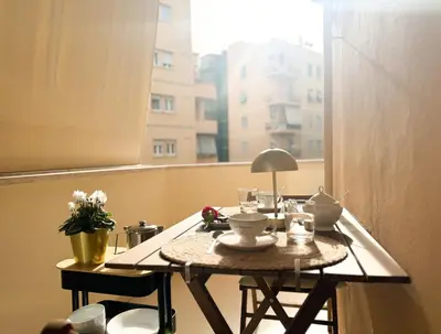 a table in a room with a window at Il Sogno di Balduina a 1 min Stazione Appiano-Ospedale Gemelli in Rome