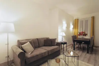 a living room with a couch and a table at Centro Roma Giallo - LOCAPPART in Rome