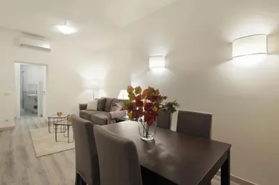 a living room with a couch and a table at Centro Roma Giallo - LOCAPPART in Rome