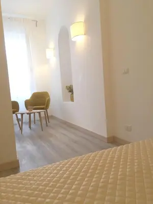 a bedroom with a large bed and two lamps at Centro Roma Grande - LOCAPPART in Rome