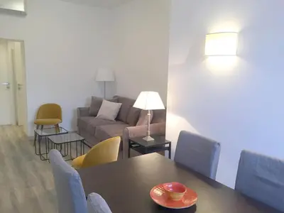 a living room with a table and a couch at Centro Roma Grande - LOCAPPART in Rome