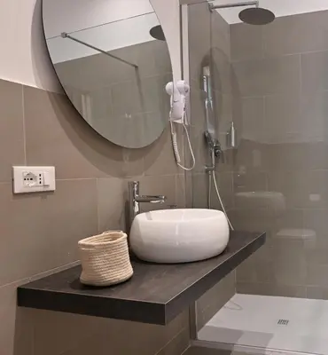 a bathroom with a sink and a mirror at Jubilee 4 Your home in Rome Vatican in Rome