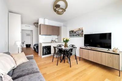 a living room with a couch and a table with chairs at Colosseum Luxury suite 26 in Rome