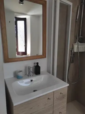 a bathroom with a white sink and a mirror at Foro appartament in Rome