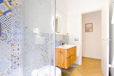 a bathroom with a shower and a sink at Elegantis Gracchi Apartment - Your Chic Retreat in Central Rome - Vatican Area in Rome