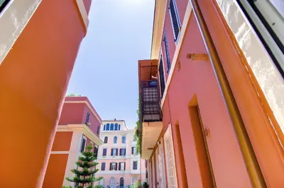 an alley in the city with buildings at Elegantis Veniero Suite Apartment - 1 Minute Walk to Vatican Museums in Rome