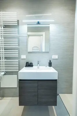 a bathroom with a white sink and a mirror at Casa Gemma Rome in Rome