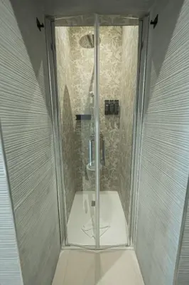 a shower with a glass door in a bathroom at Casa Gemma Rome in Rome