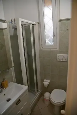 a bathroom with a shower and a toilet and a sink at Stefy's House Appio Tuscolano in Rome
