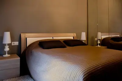 a bedroom with a bed with two pillows on it at St Peter Vatican wonderfull view apartment in Rome