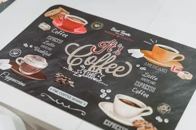 a menu with cups of coffee on a table at Vacanze Romane - Metro Teano & Wi-Fi in Rome