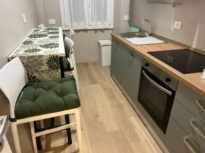 a bathroom with a white toilet and a sink at Living Aurelia - San Pietro in Rome