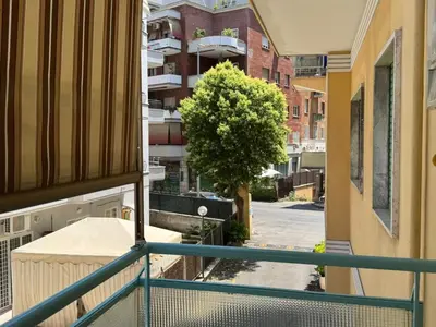 a group of potted plants in front of a building at Living Aurelia - San Pietro in Rome