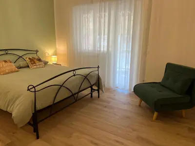 a bedroom with a bed with a wrought iron frame at Living Aurelia - San Pietro in Rome