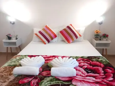 a bedroom with a bed with towels on it at TravelR's Home in Rome