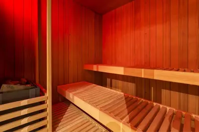 a small sauna with two bunk beds in it at Leon's Place Hotel In Rome in Rome