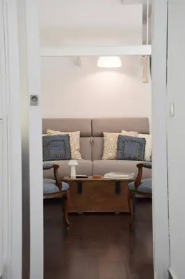 a living room with a couch and two chairs at Casa Mari Vaticano in Rome