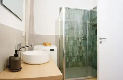 a bathroom with a shower and a sink and a toilet at Simi Roma Palombini, Appartamento con Giardino in Rome
