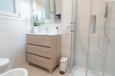 a bathroom with a sink and a shower at Domus Aurea2 a stone's throw from the Colosseum in Rome