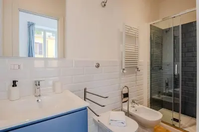 a bathroom with a sink and a toilet and a shower at Dante Art Home in Rome