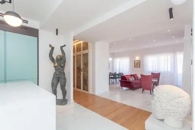 a living room with a statue of a woman on a wall at Arte della Medaglia Gallery House in Rome