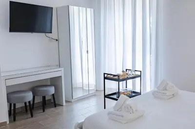 a white room with a fireplace and a tv at Vatican LeM collection in Rome