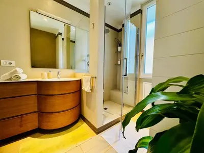 a bathroom with a sink and a mirror at Borgo Pio Suite Apartment in Rome
