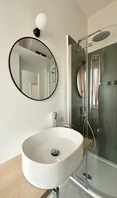 a white kitchen with a sink and a window at Casa Mazz San Giovanni in Rome