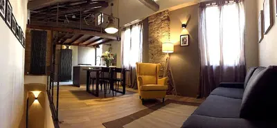 a living room with a couch and a table at Loft Navona in Rome