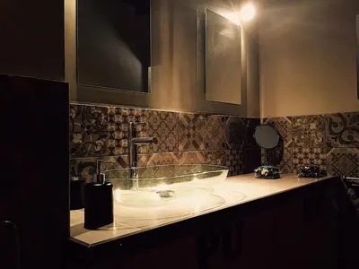 a bathroom with a sink with a glass bowl at Loft Navona in Rome