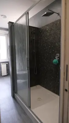 a shower with a glass door in a bathroom at B&B Caput Mundi in Rome