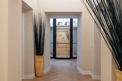 a hallway with a vase with plants in it at Scipioni 235 Luxury Suite in Rome