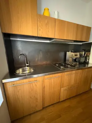a kitchen with a sink and a stove at Loft in Colosseum, style in the heart of Rome! in Rome