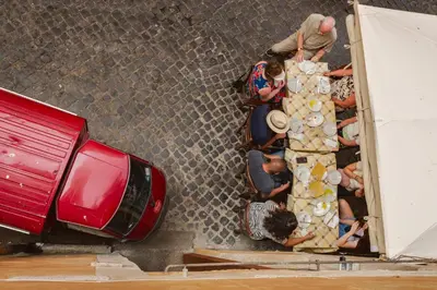 a group of people standing next to a truck at Locanda da Enzo in Rome