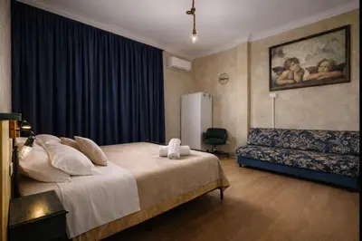 a bedroom with a bed in a room at The Attic Penthouse Rome Cozy & Comfy Close to Trastevere & Center With WIFI in Rome