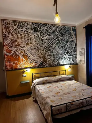 a dining room with a table and a window at The Attic Penthouse Rome Cozy & Comfy Close to Trastevere & Center With WIFI in Rome