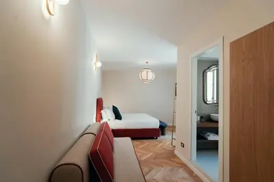 a hotel room with a bed and a couch at Casa Mia Navona in Rome