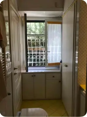 a bathroom with a window and a sink in it at Camera Trastevere 2 in Rome