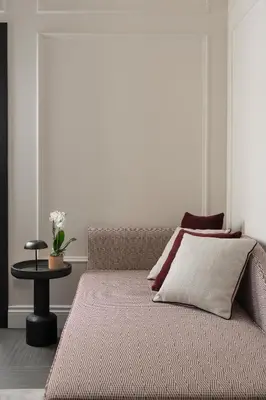 a bed sitting in a room with a table at Casa Guttmann in Rome