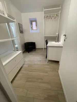 a room with a desk and a chair and a table at Petite Fleur in Rome