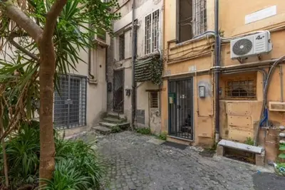 an empty street in front of a building at Loft in the Ghetto 2 in Rome