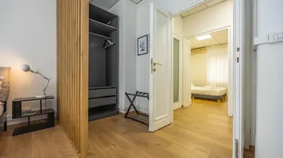 a hallway with a room with a bed and a door at Flat 5 - In San Giovanni by Rentbeat in Rome