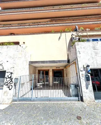 a gate on the side of a building at Piramide Charming Flat e Terrace in Rome