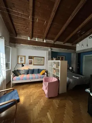 a living room with a couch and a bed at Monolocale Centro Stazione Tiburtina in Rome