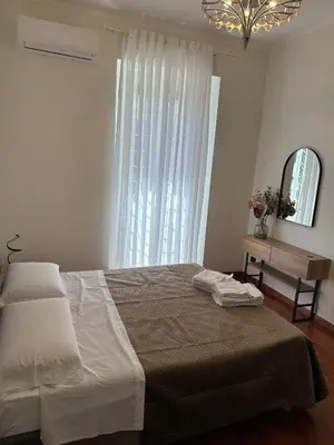 a bedroom with a bed and a mirror and a table at 3 coins trastevere station in Rome